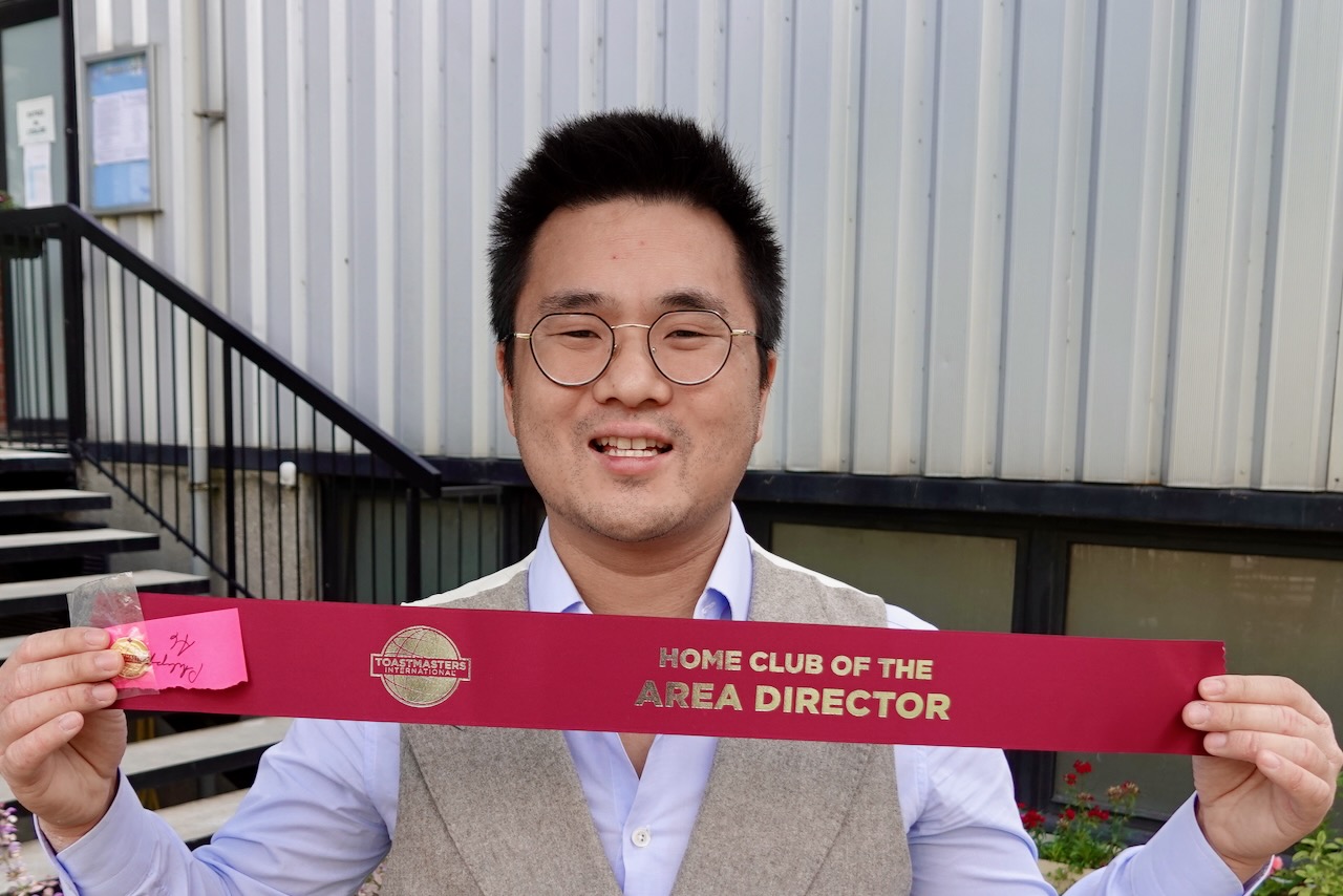 Area Director Philippe-Minh Nguyen with his Home of Area Director ribbon and Director pin
